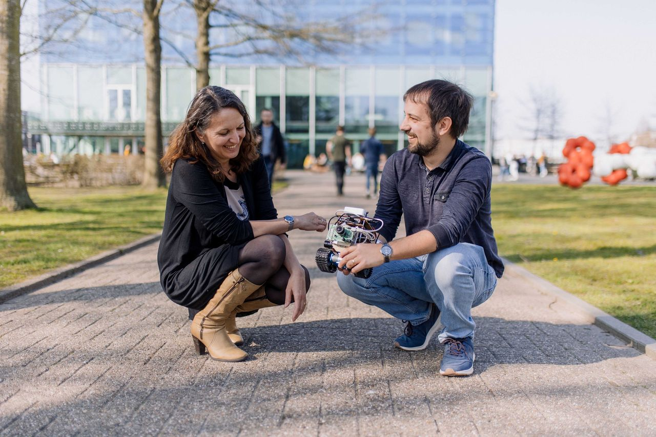 Professor Elisabetta Chicca, Professor at CogniGron, inspecting a robot using Neuromorphic sensor technology.